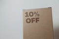 Cardboard box with 10% off order written on the box