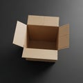 Cardboard box with open flaps on a dark surface. The box is empty and made of Royalty Free Stock Photo