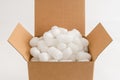 Cardboard box with packing peanuts Royalty Free Stock Photo