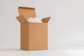 Cardboard box with packing peanuts Royalty Free Stock Photo