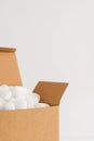 Cardboard box with packing peanuts Royalty Free Stock Photo