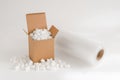 Cardboard box with packing peanuts Royalty Free Stock Photo