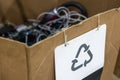 Cardboard box with paper sheet recycling sign. Collection point of discarded broken household appliances. Reusable Royalty Free Stock Photo