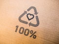 Cardboard box with 100% recycling printed label logo sign. Royalty Free Stock Photo