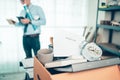 Cardboard box and resignation letter, dossier, alam clock, coffee cup, calculator and drawing tube in box. Quiting a job, Royalty Free Stock Photo