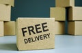 Cardboard box with sign free delivery Royalty Free Stock Photo