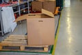 Cardboard box in stock. Wooden pallet. Production background