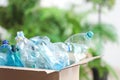 Cardboard box with used plastic bottles on blurred background. Royalty Free Stock Photo