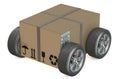 Cardboard box with wheels - shipping concept Royalty Free Stock Photo