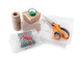 Cardboard boxes, bubble wrap, scissors and adhesive tape on white background Royalty Free Stock Photo