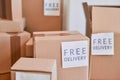 Cardboard boxes of different sizes and with free delivery labels Royalty Free Stock Photo