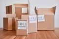 Cardboard boxes of different sizes and with free delivery labels Royalty Free Stock Photo