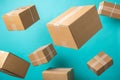 Cardboard boxes flying isolated on turquoise background Royalty Free Stock Photo