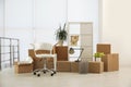 Cardboard boxes with packed stuff in office. Moving day Royalty Free Stock Photo