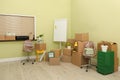 Cardboard boxes with packed stuff in office. Moving day Royalty Free Stock Photo