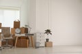 Cardboard boxes and packed stuff in, space for text. Moving day Royalty Free Stock Photo