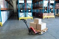 Cardboard boxes on a pallet jack in warehouse Royalty Free Stock Photo