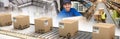 Composite image of cardboard boxes on production line Royalty Free Stock Photo