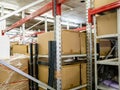 cardboard boxes on racks in storeroom