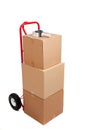 Cardboard boxes on a red hand truck Royalty Free Stock Photo