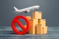 Cardboard boxes and red prohibition symbol NO. Out of stock. Embargo trade wars. Overproduction or scarcity. Restriction on import Royalty Free Stock Photo