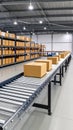 Cardboard boxes on a roller conveyor belt in a warehouse storage facility Royalty Free Stock Photo