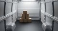 Stack of cardboard boxes inside a delivery van ready for shipping and transportation Royalty Free Stock Photo