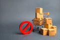 Cardboard boxes, supermarket trolley and red symbol NO. Embargo, trade wars. Restriction on the importation of goods, proprietary