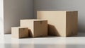 Cardboard boxes of varying sizes stacked in a clean, minimalist setting Royalty Free Stock Photo