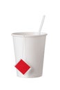 Cardboard disposable cup with tea bag and spoon on white Royalty Free Stock Photo