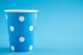 Cardboard disposable cups isolated on a blue background. Front view Royalty Free Stock Photo