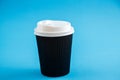 Cardboard disposable cups isolated on a blue background. Front view Royalty Free Stock Photo