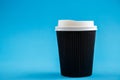 Cardboard disposable cups isolated on a blue background. Front view Royalty Free Stock Photo