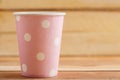 Cardboard disposable cups isolated on a wooden background. Front view Royalty Free Stock Photo