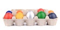 Cardboard egg box with Easter colored eggs. Royalty Free Stock Photo