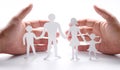 Cardboard figures of the family on a white background. Royalty Free Stock Photo