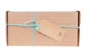 Cardboard gift box tied with blue string. Isolated on white, clipping path included Royalty Free Stock Photo