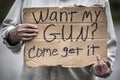 Cardboard handwritten sign, Want My Gun? Come Get It, gun laws, gun control Royalty Free Stock Photo