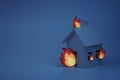 Cardboard house lit with paper fire, concept, night