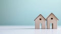 Cardboard house models on blue background Royalty Free Stock Photo