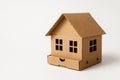 A cardboard house with a smiling face. Space for text. Royalty Free Stock Photo