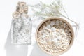 Cardboard jar with oatmeal and sea salt. Scrub the skin. Spa products Royalty Free Stock Photo