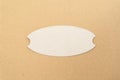 Cardboard label cutout on a cardboard background Royalty Free Stock Photo