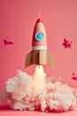 cardboard made children rocket launch on a pink background