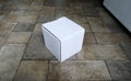 Cardboard mailing box on laminated floor