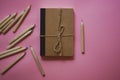 Cardboard notepad for notes tied with sacking rope bow flatly Wooden pink pencil