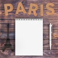 Cardboard Paris Sign with Eiffel Tower, Pen and Blank Notebook w