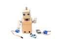 Cardboard robot with hands and different details on a white back