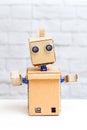 Cardboard robot with hands. Vertical photo