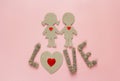 Cardboard silhouettes girl and boy with hearts and the word love